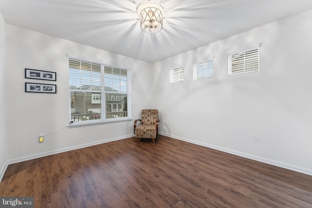 unfurnished room with dark hardwood / wood-style floors