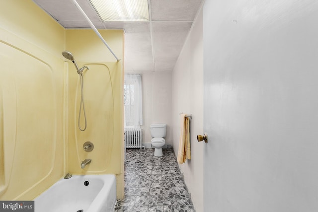 bathroom featuring radiator heating unit,  shower combination, and toilet