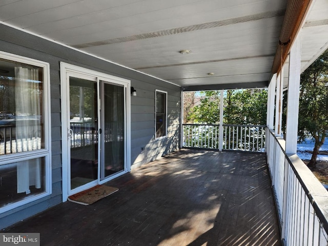 wooden deck featuring covered porch