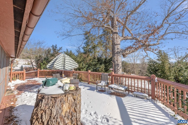 view of snow covered deck