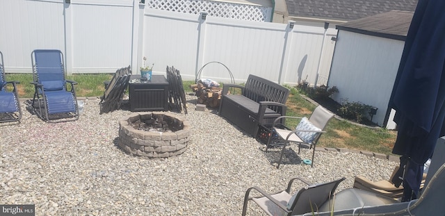 view of yard with an outdoor fire pit