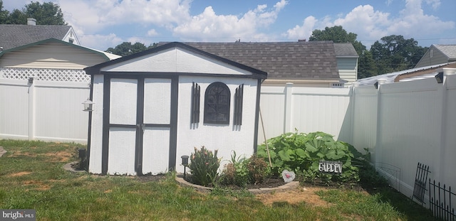 view of outdoor structure with a lawn