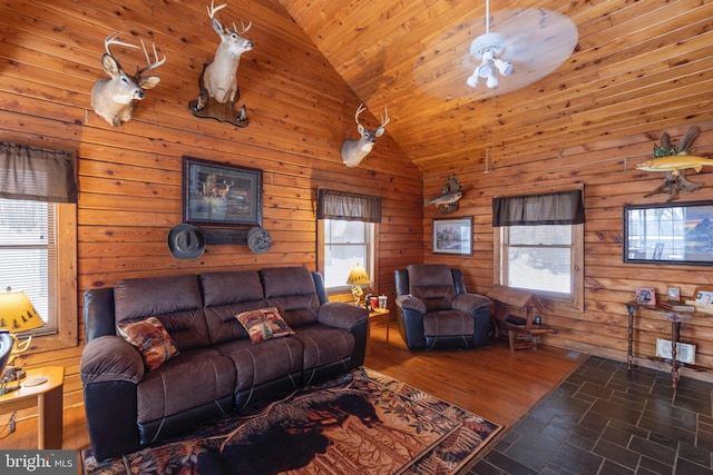 living room with high vaulted ceiling, ceiling fan, wooden walls, and wood ceiling