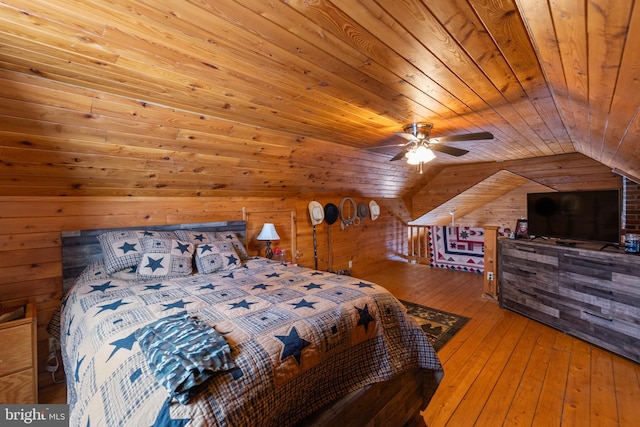 bedroom featuring wooden ceiling, lofted ceiling, wooden walls, hardwood / wood-style flooring, and ceiling fan