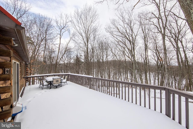 view of snow covered deck