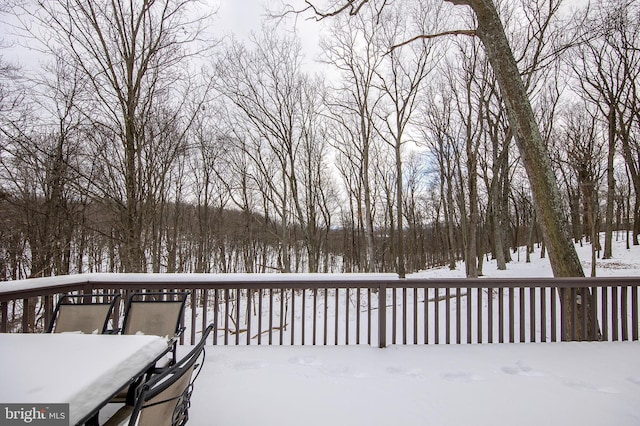 view of snow covered deck