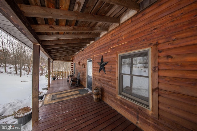 view of snow covered deck