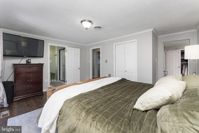 bedroom with crown molding and dark hardwood / wood-style floors