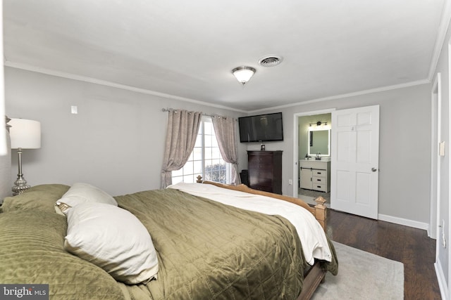 bedroom featuring connected bathroom, sink, dark wood-type flooring, and ornamental molding