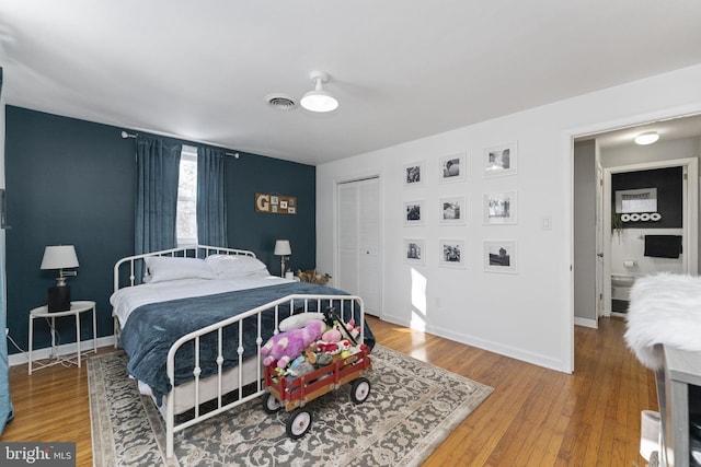 bedroom featuring a closet and hardwood / wood-style flooring