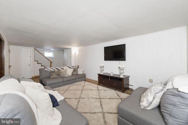 living room featuring baseboard heating and light hardwood / wood-style flooring