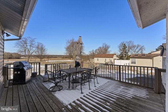 wooden terrace featuring area for grilling