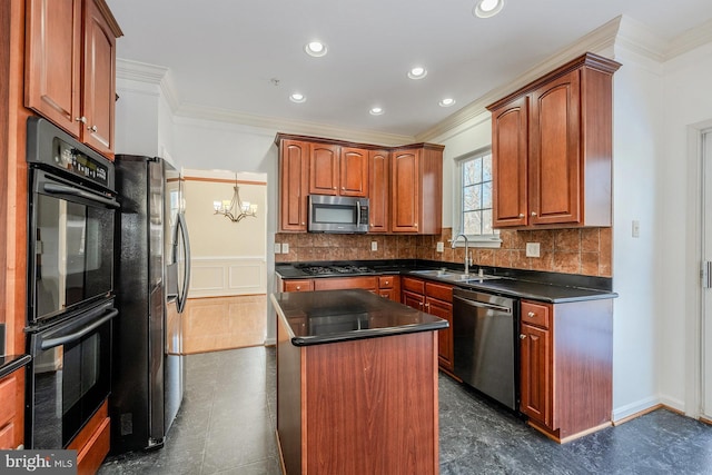 kitchen with sink, a center island, a notable chandelier, black appliances, and crown molding