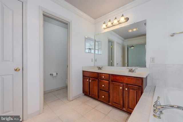 bathroom featuring toilet, crown molding, vanity, a bathtub, and tile patterned flooring