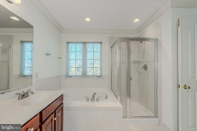 bathroom with ornamental molding, independent shower and bath, tile patterned flooring, and vanity