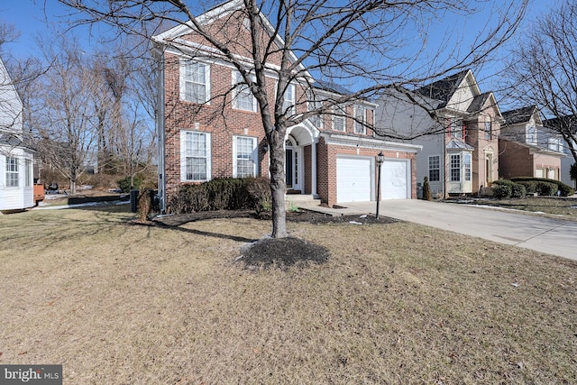 view of property with a garage and a front lawn