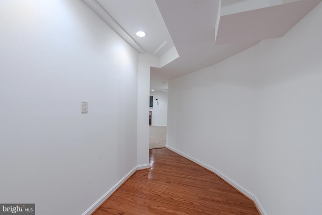 corridor featuring hardwood / wood-style floors