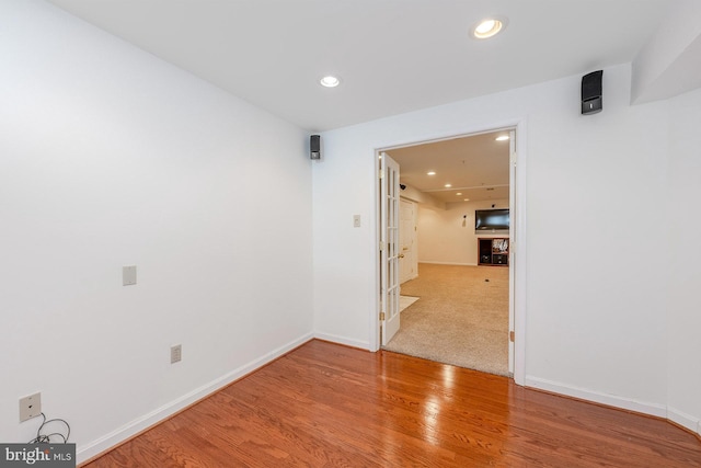 unfurnished room featuring hardwood / wood-style flooring