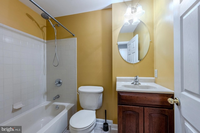 full bathroom with vanity, tiled shower / bath, tile patterned floors, and toilet