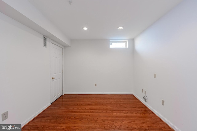 basement with wood-type flooring