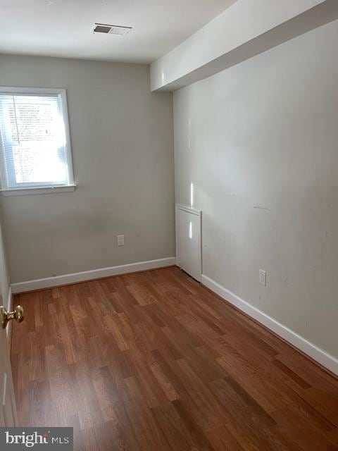 empty room featuring hardwood / wood-style flooring