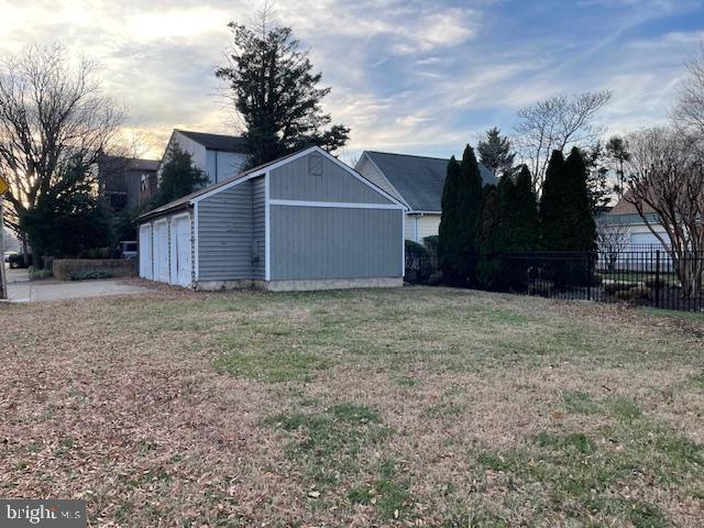 yard at dusk with an outbuilding