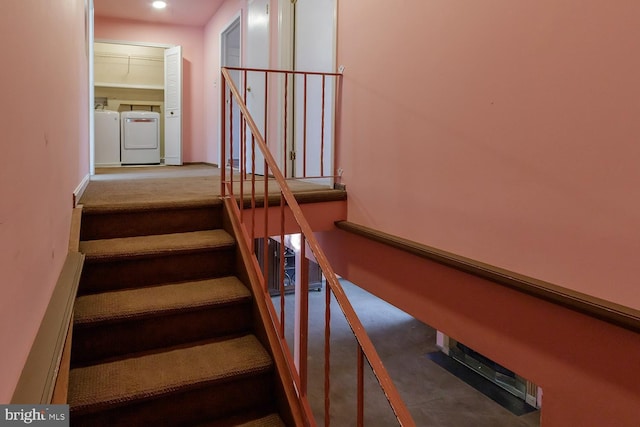 stairs with separate washer and dryer and carpet flooring