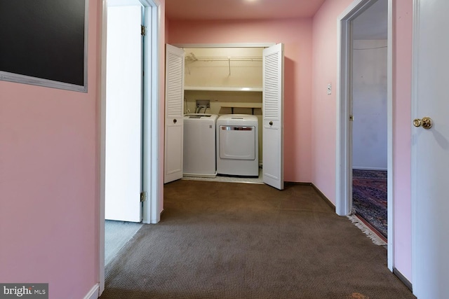 hall with washing machine and dryer and carpet