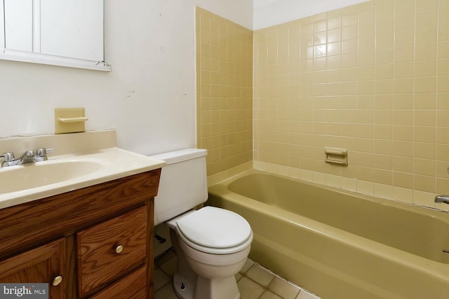 full bathroom with vanity, toilet, tiled shower / bath combo, and tile patterned flooring