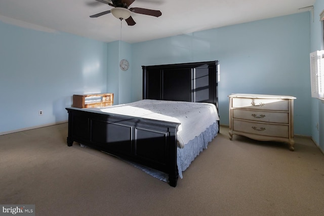 bedroom featuring light carpet and ceiling fan