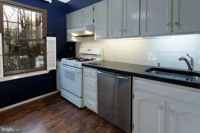 kitchen with sink, white cabinets, dark hardwood / wood-style flooring, stainless steel dishwasher, and white gas stove