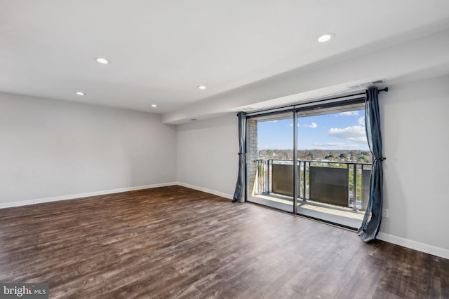 spare room featuring dark hardwood / wood-style floors