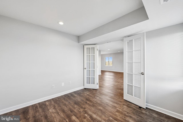 unfurnished room featuring french doors and dark hardwood / wood-style floors