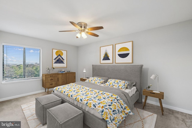 bedroom with light carpet and ceiling fan