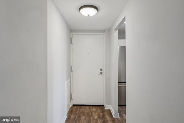 corridor featuring dark hardwood / wood-style floors