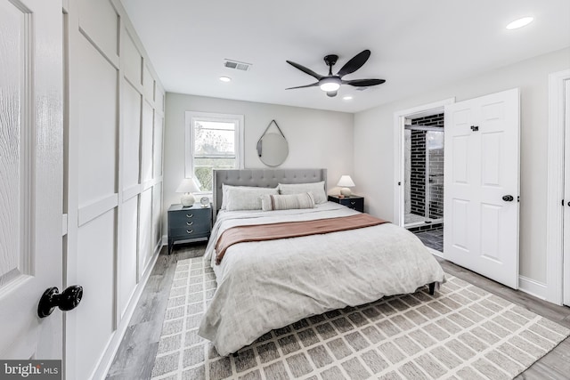 bedroom with ceiling fan and hardwood / wood-style flooring