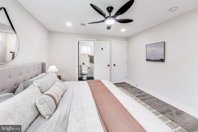 bedroom with ensuite bath, ceiling fan, and light hardwood / wood-style flooring