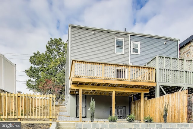 rear view of property with a deck