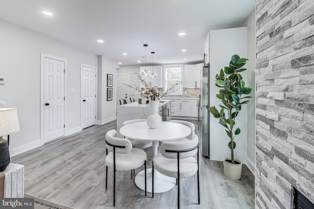 dining room with light hardwood / wood-style floors