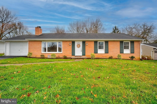 single story home with a garage and a front lawn