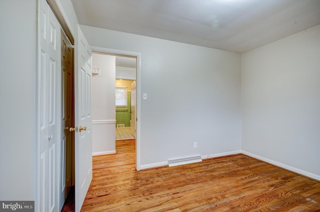 unfurnished bedroom featuring light wood-type flooring