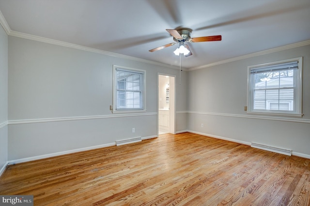 empty room featuring light hardwood / wood-style floors, ceiling fan, and crown molding