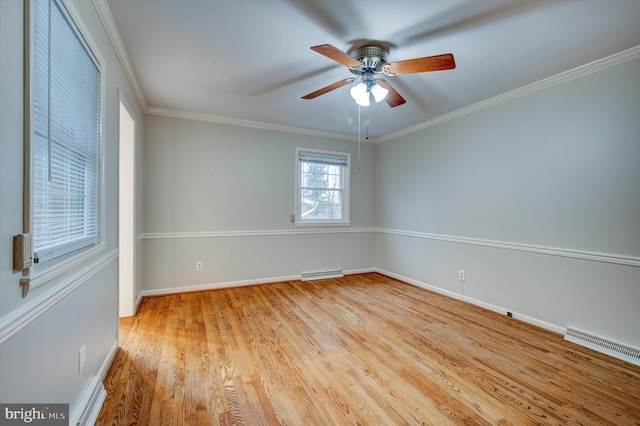 empty room with light hardwood / wood-style flooring, ceiling fan, and ornamental molding