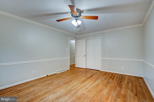 unfurnished bedroom featuring ceiling fan, light hardwood / wood-style floors, ornamental molding, and a closet