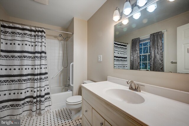 full bathroom with vanity, tile patterned flooring, shower / bathtub combination with curtain, and toilet