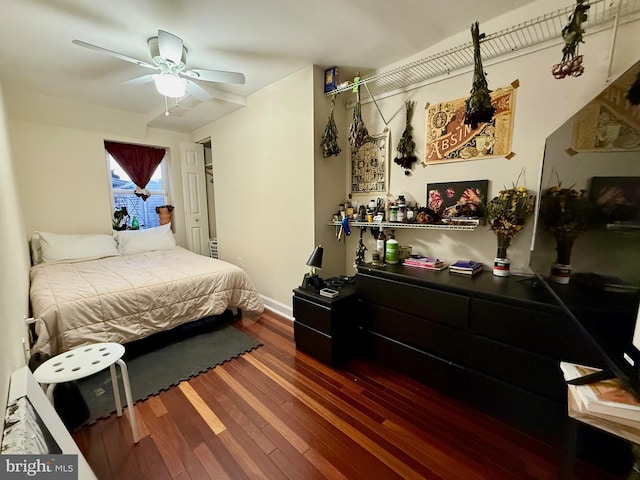 bedroom featuring hardwood / wood-style floors and ceiling fan