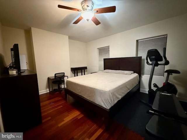 bedroom with ceiling fan and dark hardwood / wood-style floors