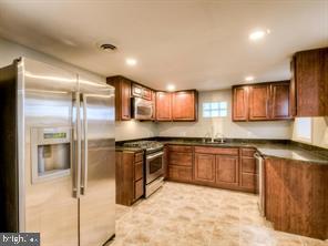 kitchen featuring appliances with stainless steel finishes and sink