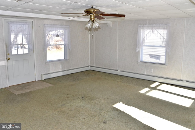 entryway featuring carpet, a drop ceiling, baseboard heating, and ceiling fan