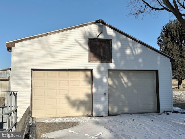 view of snow covered garage